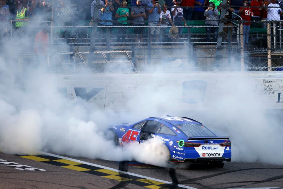 Bubba Wallace does a burnout after winning a NASCAR Cup Series auto race at Kansas Speedway in Kansas City, Kan., Sunday, Sept. 11, 2022. (AP Photo/Colin E. Braley)