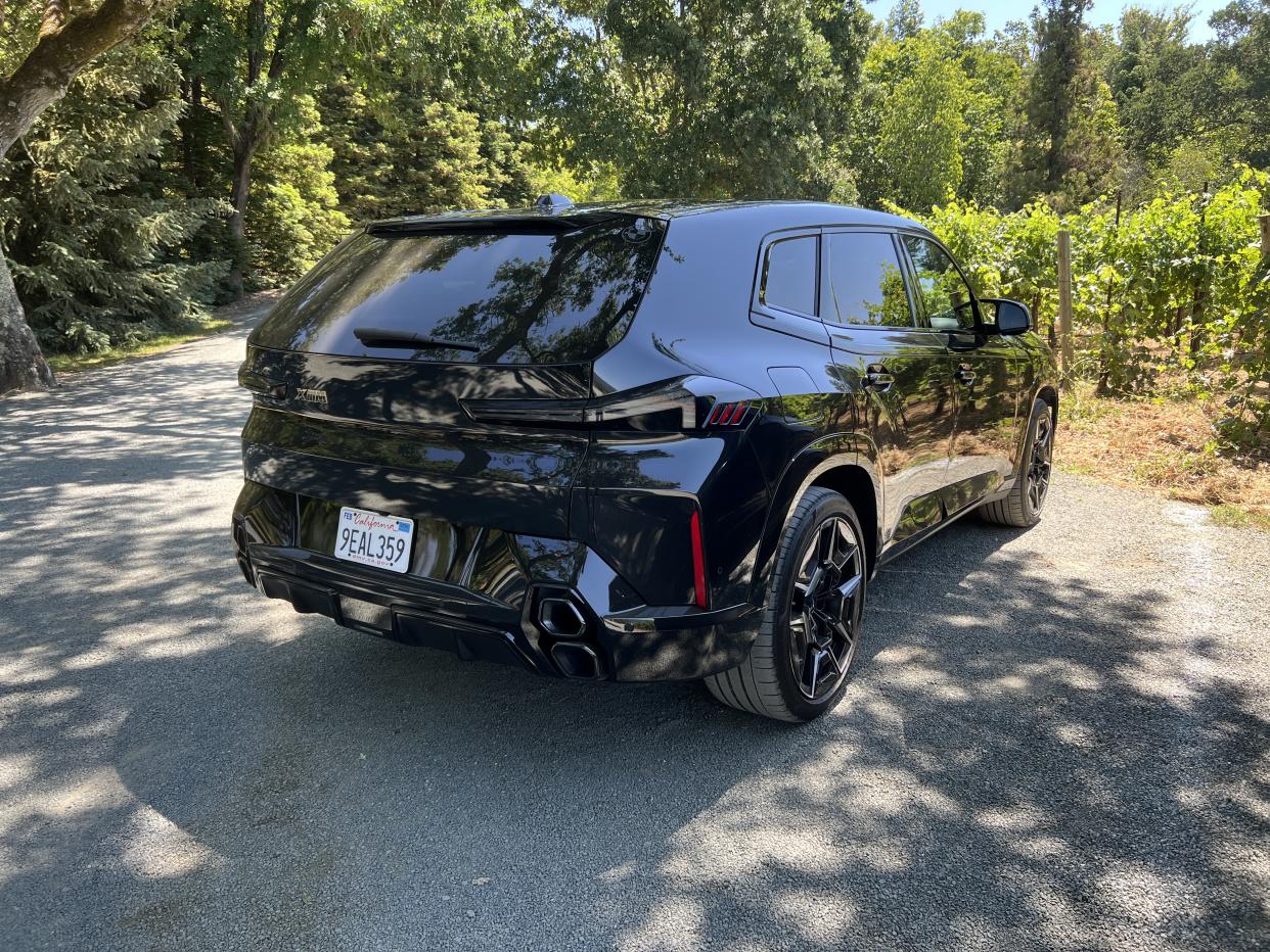 The BMW XM SAV is pictured from behind.