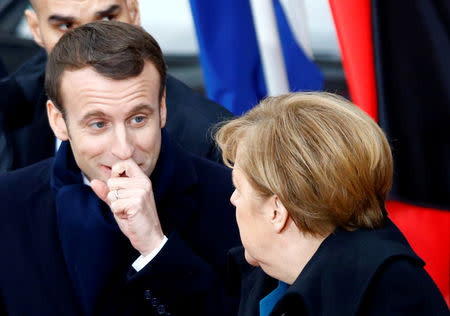 FILE PHOTO: German Chancellor Angela Merkel and French President Emmanuel Macron leave Aachen Town Hall after signing a new agreement on bilateral cooperation and integration, known as theTreaty of Aachen, in Aachen, Germany, January 22, 2019. REUTERS/Thilo Schmuelgen