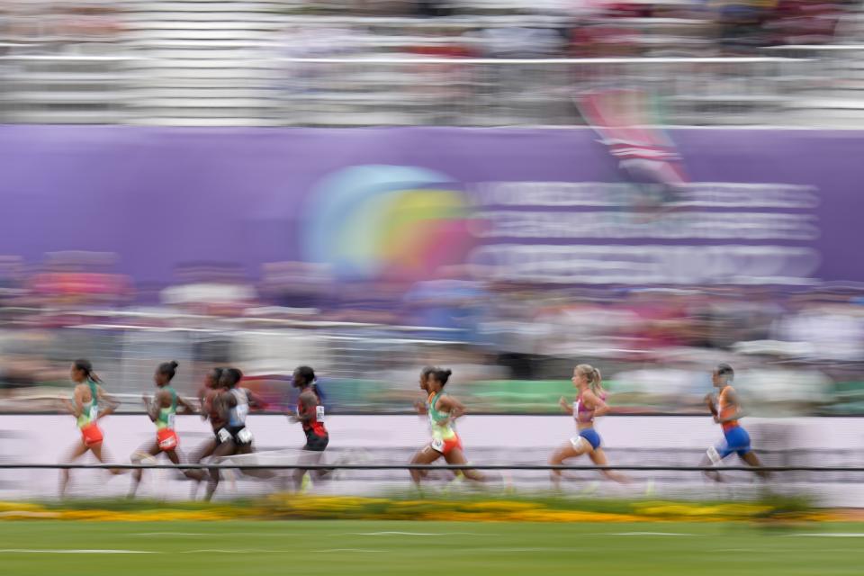 Athletes compete in the women's 10000-meter run final at the World Athletics Championships on Saturday, July 16, 2022, in Eugene, Ore.(AP Photo/Ashley Landis)