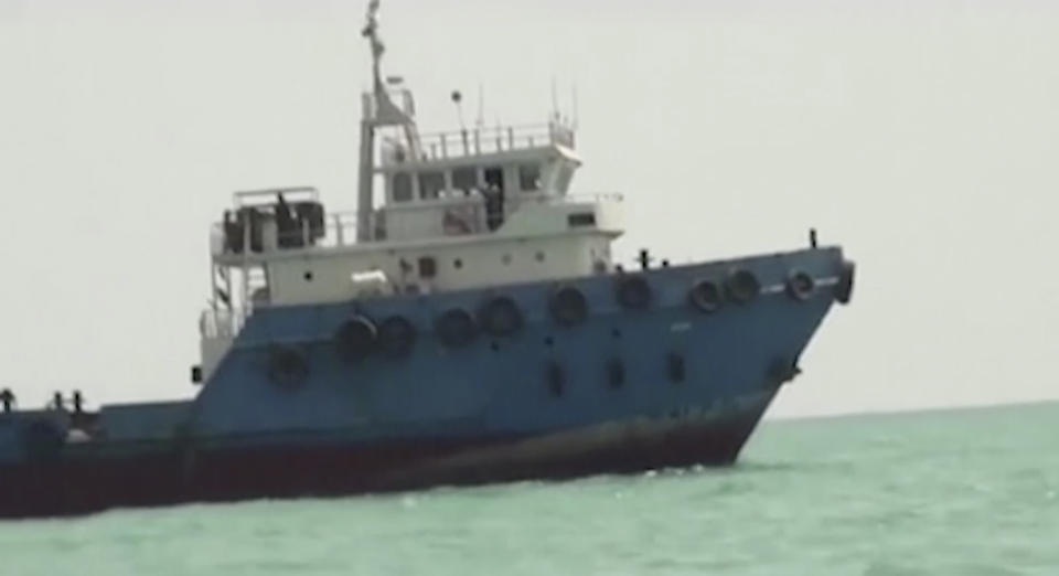 This undated image made from a video provided by the IRGC/IRIB shows a ship in the Persian Gulf. Iranian forces seized the ship, which it suspected of carrying smuggled fuel, state media reported Sunday, Aug. 4, 2019, marking the Revolutionary Guard's third seizure of a vessel in recent weeks and the latest show of strength by the paramilitary force amid a spike in regional tensions. (IRGC/IRIB via AP)