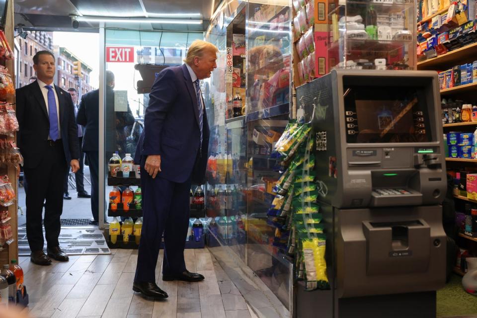 Following his second day in court, Donald Trump made a stop at a Harlem bodega, where a clerk stabbed an ex-con to death in self-defense in 2022 (AP)