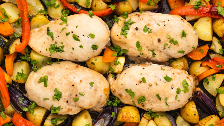 Close up of baked chicken and veg