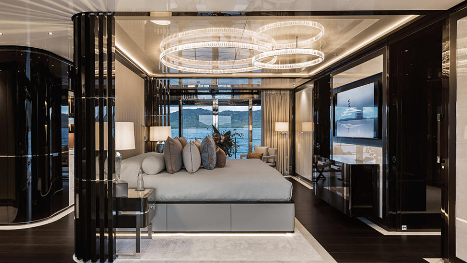 The owner’s suite sports a giant custom chandelier. - Credit: ISA Yachts