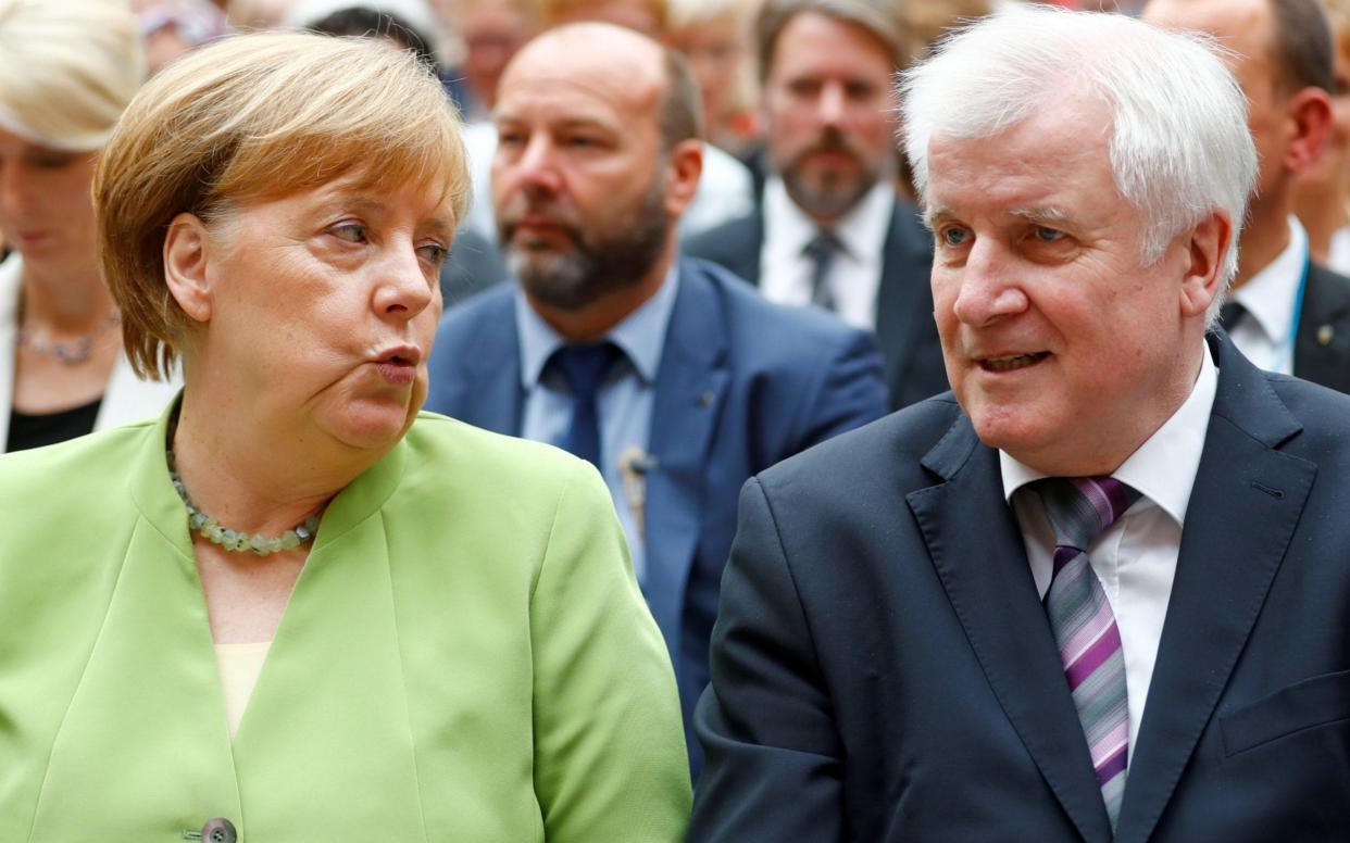 German Chancellor Angela Merkel and German Interior minister Horst Seehofer will meet for crunch talks  - Reuters