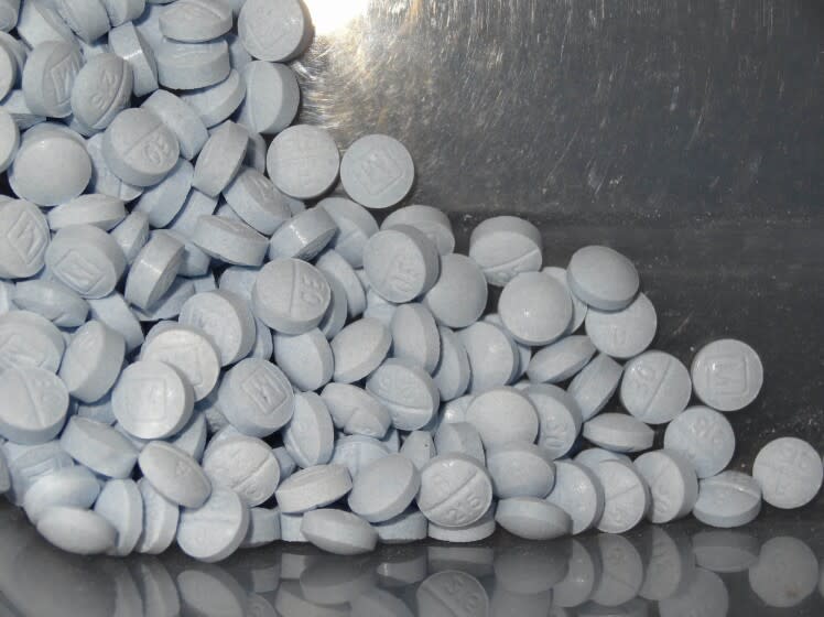 FILE - This undated file photo provided by the U.S. Attorneys Office for Utah and introduced as evidence at a trial shows fentanyl-laced fake oxycodone pills collected during an investigation. Congress has voted to temporarily extend a sweeping tool that has helped federal agents crack down on drugs chemically similar to fentanyl. The Senate on Thursday, April 29, 2021, approved legislation extending until October an order that allows the federal government to classify so-called fentanyl analogues as Schedule I controlled substances. The drugs are generally foreign-made with a very close chemical makeup to the dangerous opioid. (U.S. Attorneys Office for Utah via AP, File)