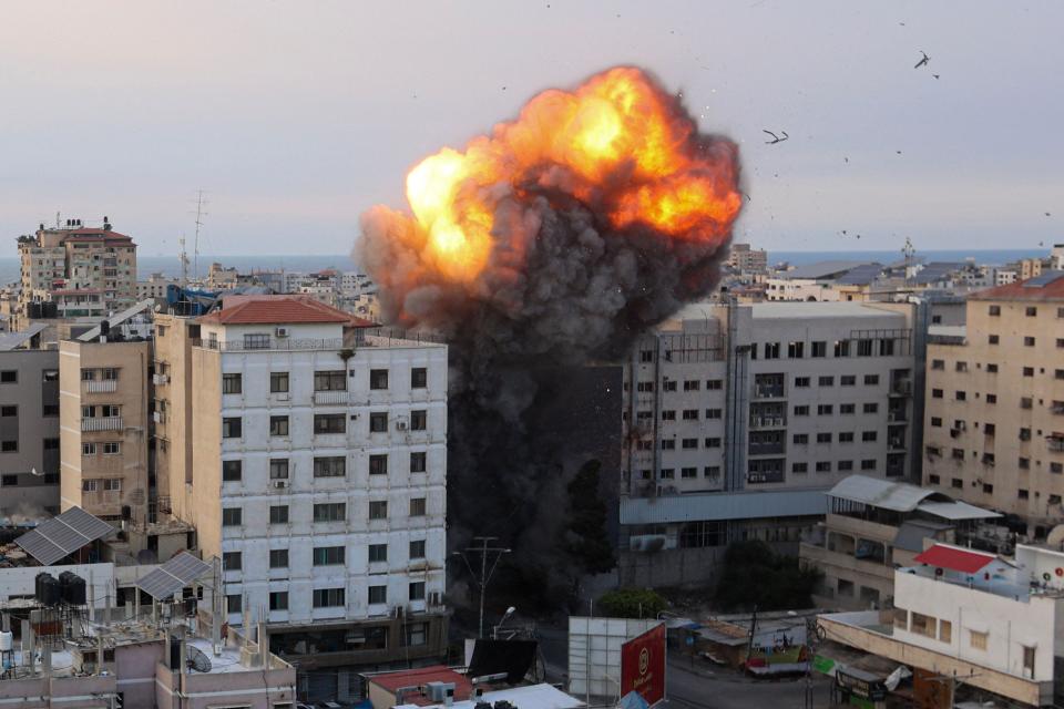 October 8, 2023 : Fire and smoke rise after an Israeli air strike targeted the National Bank on Gaza City. Israel, reeling from the deadliest attack on its territory in half a century, formally declared war on Hamas Sunday as the conflict's death toll neared 1,000 after the Palestinian militant group launched a massive surprise assault from Gaza.