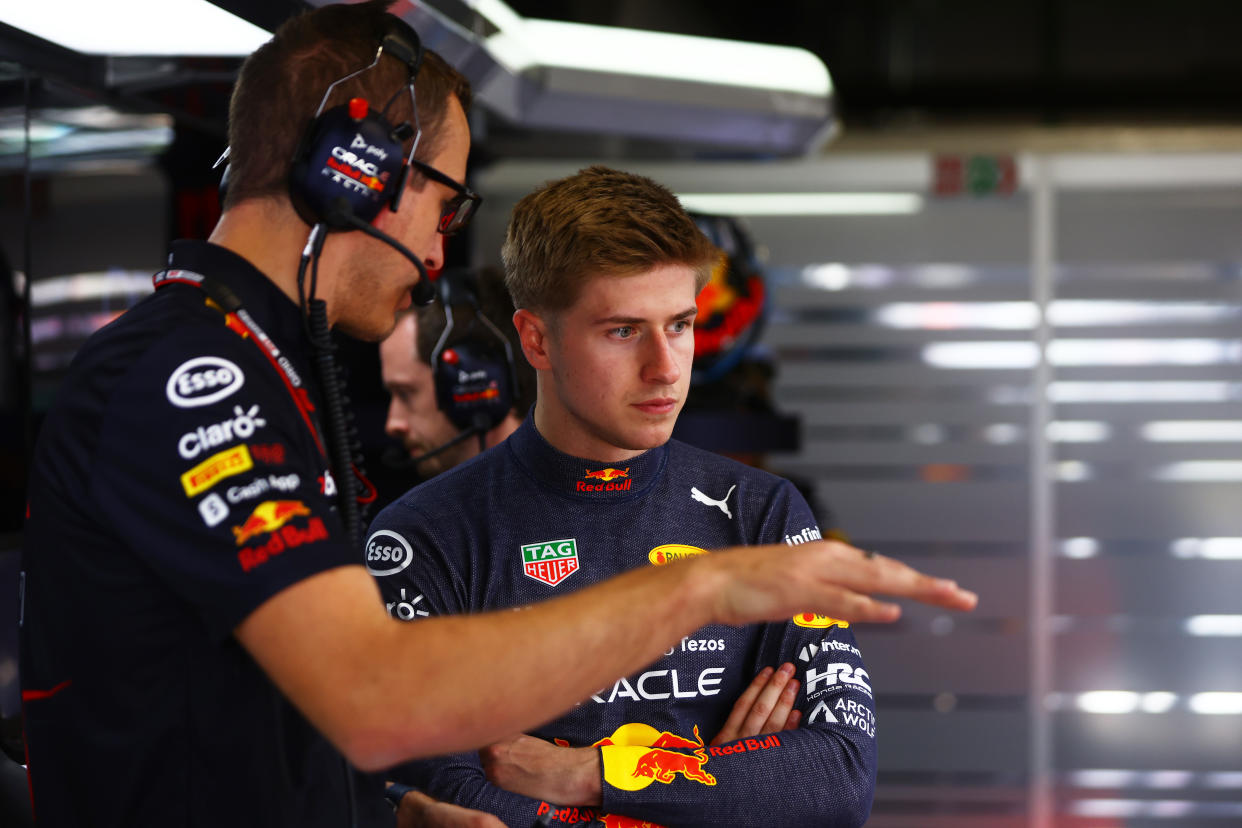BARCELONA, SPAIN - MAY 20: Juri Vips of Estonia and Oracle Red Bull Racing talks with race engineer Hugh Bird in the garage during practice ahead of the F1 Grand Prix of Spain at Circuit de Barcelona-Catalunya on May 20, 2022 in Barcelona, Spain. (Photo by Mark Thompson/Getty Images)