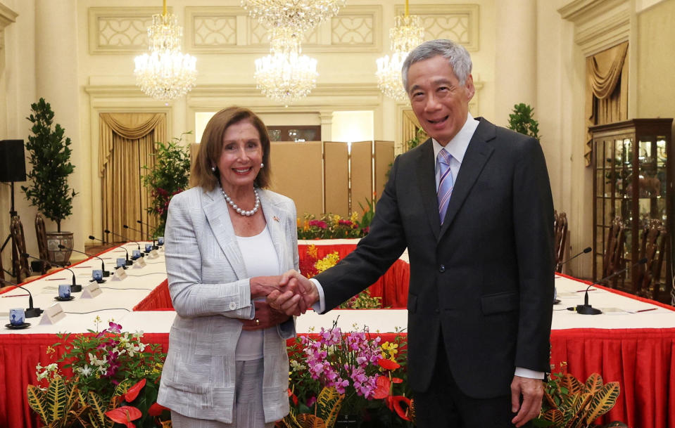 House Speaker Nancy Pelosi shakes hands with Singapore's Prime Minister Lee Hsien Loong in Singapore on August 1, 2022.  / Credit: Mohd Fyrol, Official Photographer / (Singapore) Ministry of Communications and Information / Handout via Reuters