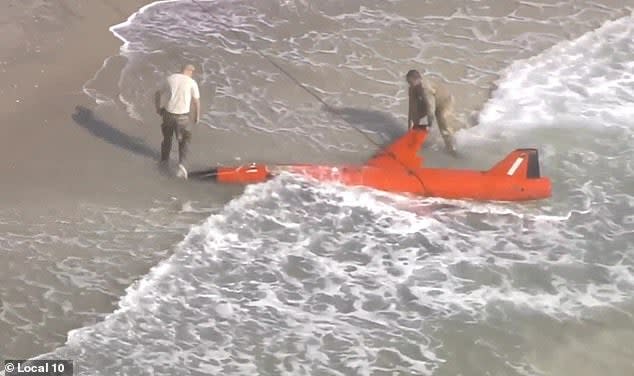 A US Air Force drone washed up on a Florida beach after it was shot down during a training exercise  (Screengrab via Twitter)