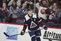 Colorado Avalanche center Nathan MacKinnon (29) reacts to his goal against the Minnesota Wild during an NHL hockey game Tuesday, April 9, 2024, in Denver. (AP Photo/Bart Young)