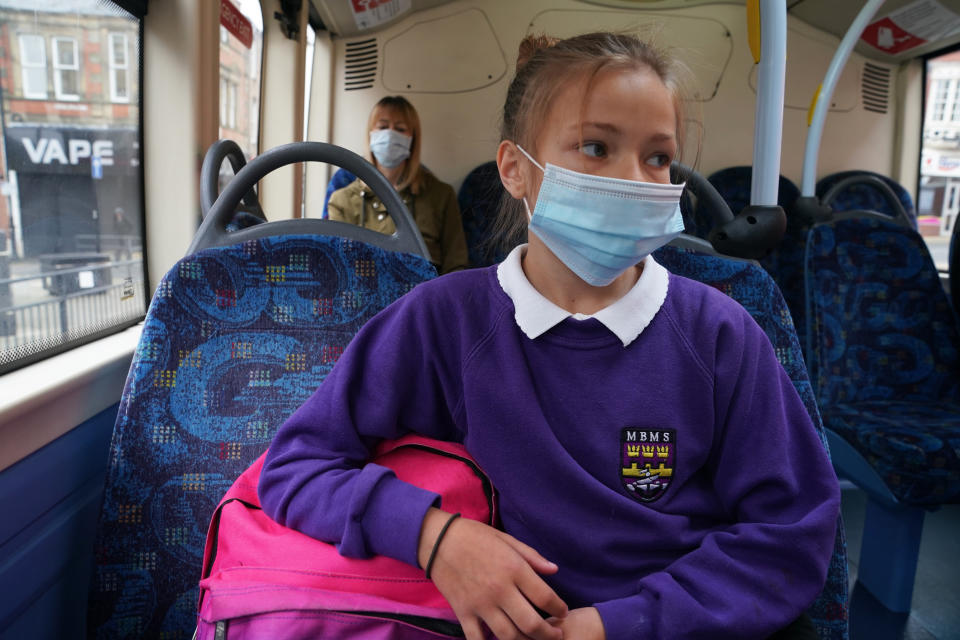 (Permission granted) A school pupil wearing a face mask on a bus in Newcastle as face coverings become mandatory on public transport in England with the easing of further lockdown restrictions during the coronavirus pandemic. (Photo by Owen Humphreys/PA Images via Getty Images)