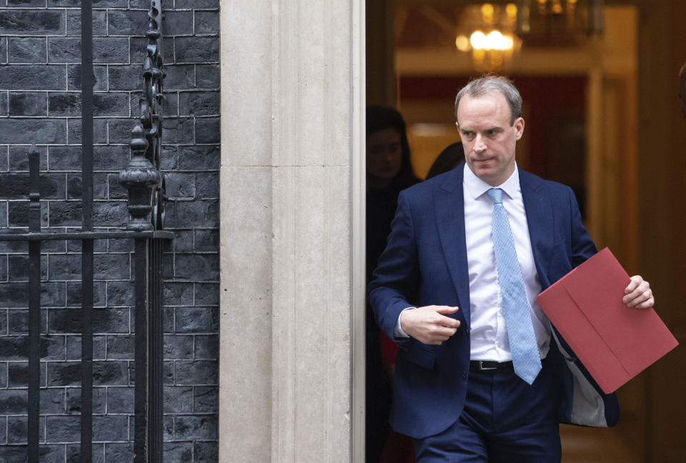 Britain's Foreign Secretary Dominic Raab leaves a meeting in Downing Street, London, Monday April 6, 2020.  Britain's Prime Minister Boris Johnson has been moved to the intensive care unit of a London hospital on Monday, April 6, 2020 after his coronavirus symptoms worsened. Johnson’s office says Johnson is conscious and does not require ventilation at the moment. Johnson was admitted to St. Thomas’ Hospital late Sunday, 10 days after he was diagnosed with COVID-19.  Johnson has asked Foreign Secretary Dominic Raab to deputize for him. (Dominic Lipinski/PA via AP)