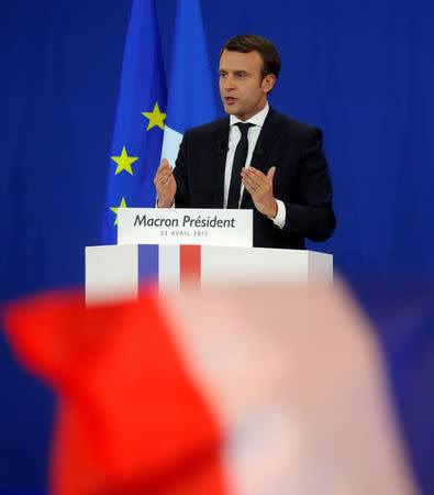 Emmanuel Macron, head of the political movement En Marche !, or Onwards !, and candidate for the 2017 French presidential election, speaks to supporters after the first round of 2017 French presidential election at a polling station in Paris, France, April 23, 2017. REUTERS/Philippe Wojazer