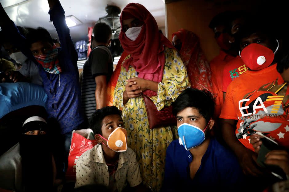 Migrant workers exit Dhaka by train on March 24, the day before Hasina's announcement.