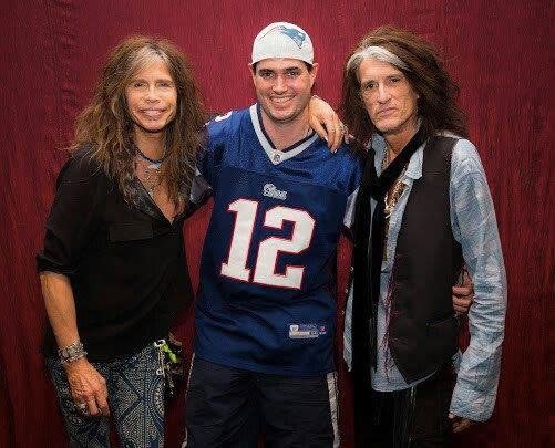 Paul Lambert pictured with members of rock group Aerosmith. Photo: Facebook