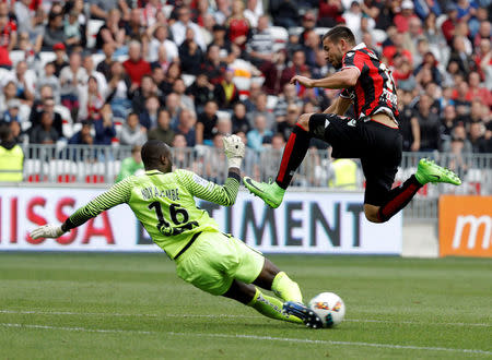 Football Soccer - Nice v Nancy - French Ligue 1 - Allianz Riviera Stadium, Nice, France 15/04/2017 - Nice's Mickael Le Bihan in action with Nancy's goalkeeper Guy Roland Ndy Assembe. REUTERS/Eric Gaillard