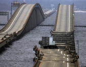 FILE - A tractor trailor rests on a section of I-10 bridge that crosses Escambia Bay, in Pensacola, Fla., Sept. 16, 2004, that was washed and damaged by Hurricane Ivan. Hurricanes beginning with the letter "I" have been among the most destructive to strike the United States, moreso than any other letter of the alphabet. Idalia is on a path to strike Florida's Gulf Coast as a major hurricane to join the long list of catastrophic examples. (AP Photo/Eric Gay, File)