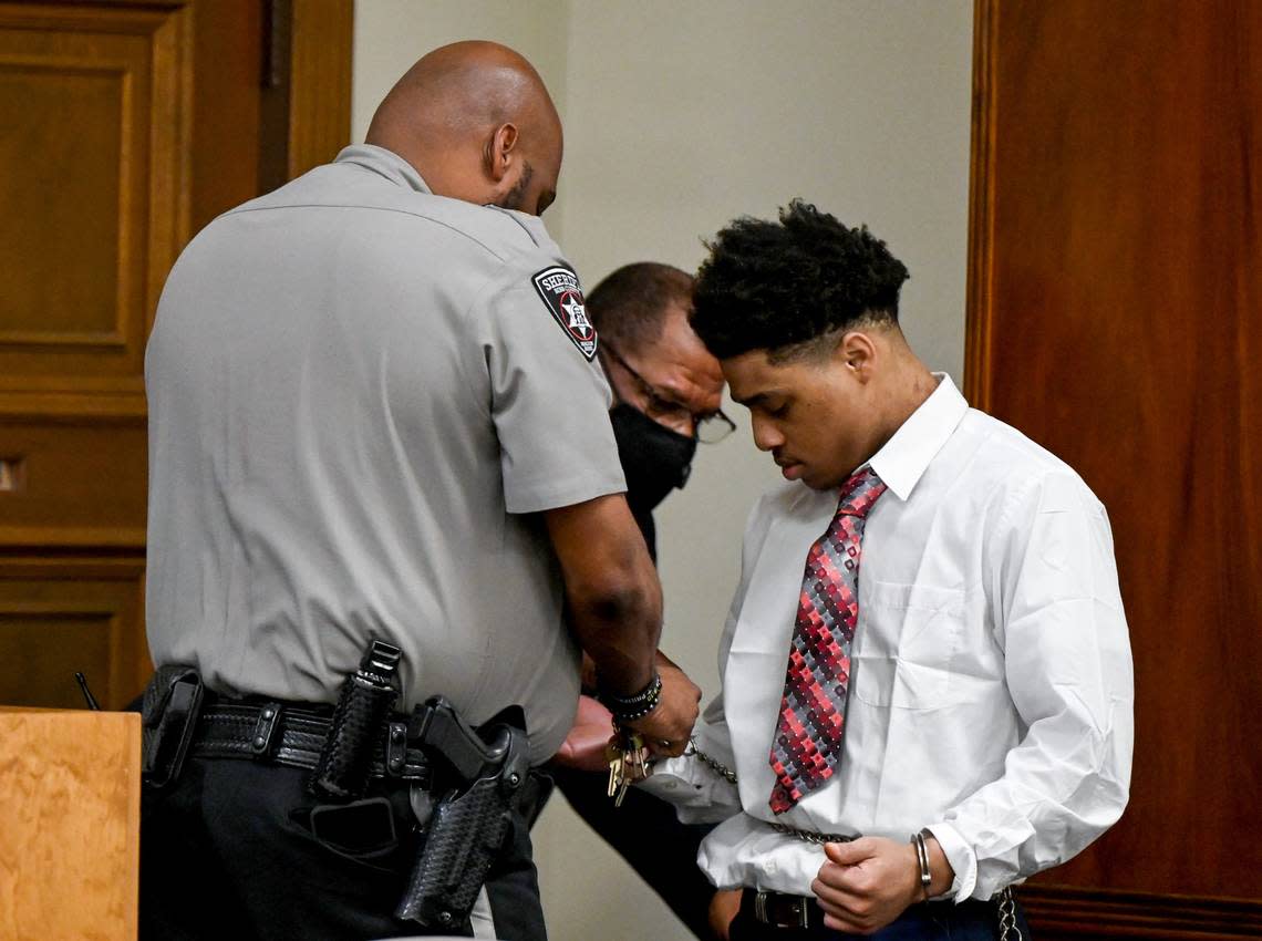 Transport restraints are removed from Jeremy Kendrick Jr. in a Bibb County Superior courtroom during his murder trial Thursday afternoon. Kendrick Jr. is charged in the holdups and killings of the clerks, who were slain a week apart in August 2018.