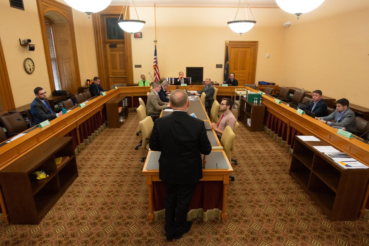 Ron Hulshizer, managing director of BKD Cyber, stands at the podium during a KDOL audit committee meeting Tuesday at the Statehouse.