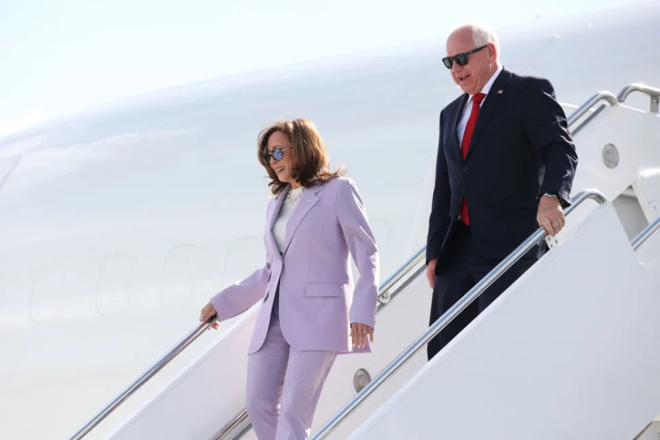 Vice President Kamala Harris and Minnesota Gov. Tim Walz arrive at Harry Reid International Airport in Las Vegas.