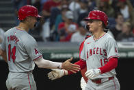 Los Angeles Angels' Logan O'Hoppe (14) congratulates Micky Moniak, right, after his three-run home run off Cleveland Guardians starting pitcher Tanner Bibee during the inning of a baseball game in Cleveland Friday, May 3, 2024. (AP Photo/Phil Long)