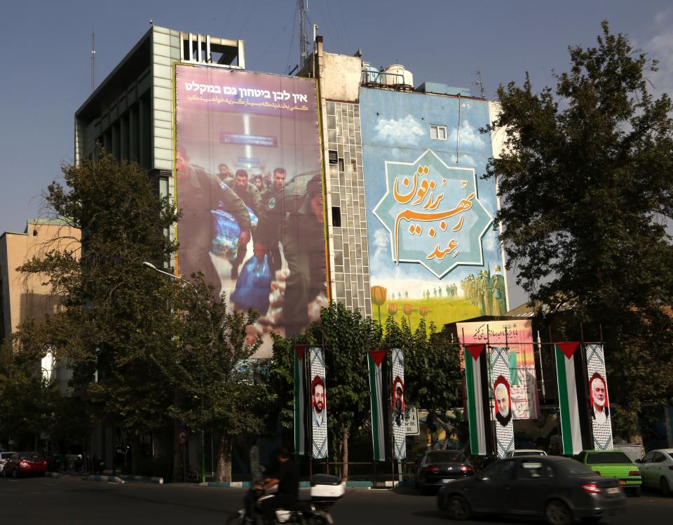 A giant anti-Israel banner hung up on a building facade at Palestine Square in Tehran (Anadolu via Getty Images)