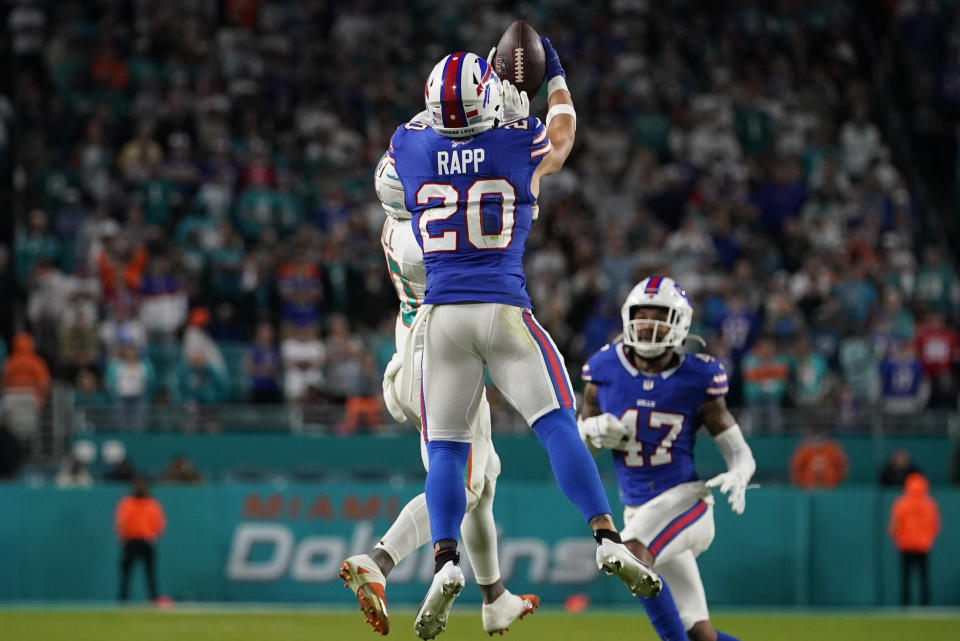 Buffalo Bills safety Taylor Rapp (20) intercepts a pass intended for Miami Dolphins wide receiver Tyreek Hill (10) during the second half of an NFL football game, Sunday, Jan. 7, 2024, in Miami Gardens, Fla. The Bills defeated the Dolphins 21-14. (AP Photo/Lynne Sladky)