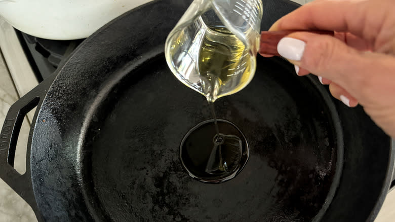 adding oil to pan