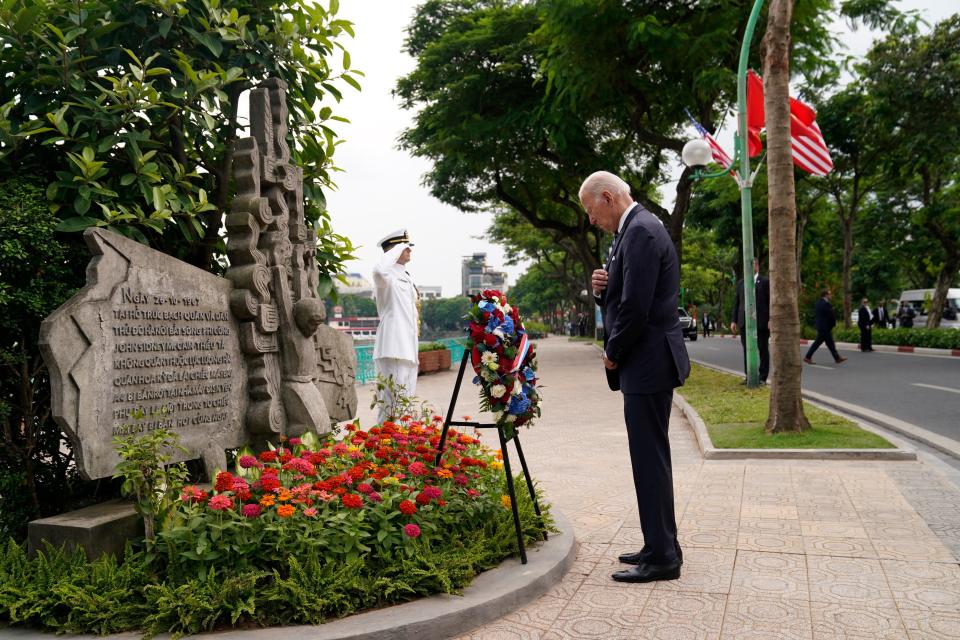 President Joe Biden pays his respects to John McCain at a memorial to the former senator in Hanoi, Vietnam, on Sept. 11, 2023. McCain was held as a prisoner of war during the Vietnam War.