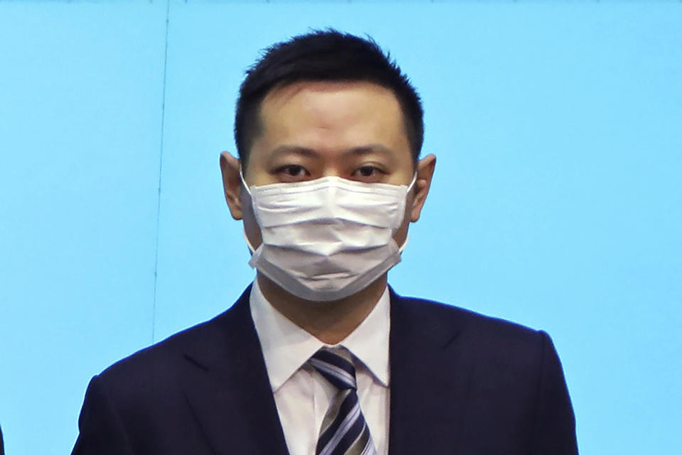 FILE - Secretary for Home Affairs Caspar Tsui lines up during a news conference in Hong Kong on April 22, 2020 to announce the new appointed principal officials. Tsui said Monday, Jan. 31, 2022 he would step down from his post, weeks after he attended a birthday party where at least one guest later tested positive for the coronavirus amid the city’s local omicron outbreak. (AP Photo/Kin Cheung, File)