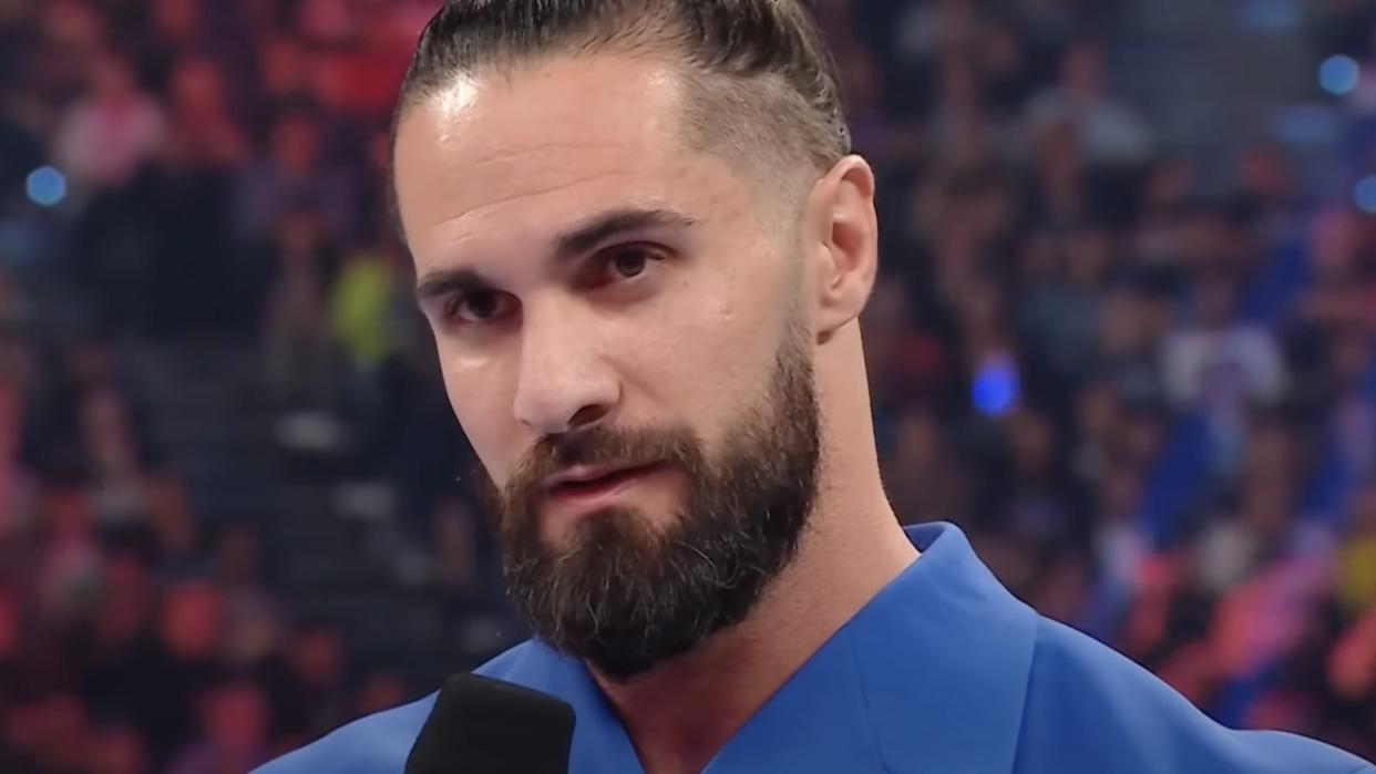  Seth Rollins speaking in the WWE ring. 