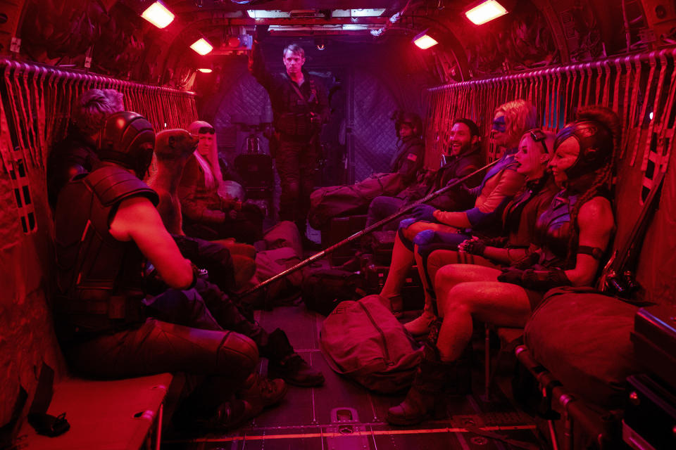 This image released by Warner Bros. Entertainment Inc. shows Joel Kinnaman, background center, in a scene from "The Suicide Squad." (Jessica Miglio/Warner Bros. Entertainment Inc. via AP)