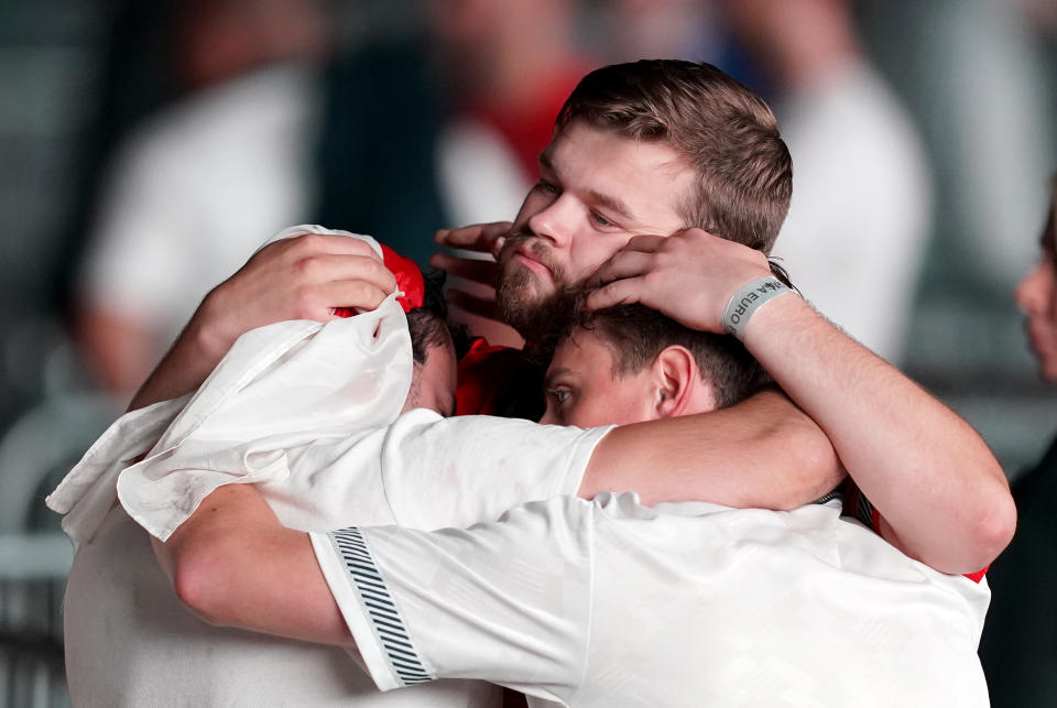 England fans are dejected after England lose the game on penalties at the fan zone in Trafford Park, Manchester as they watch the UEFA Euro 2020 Final between Italy and England. Picture date: Sunday July 11, 2021.