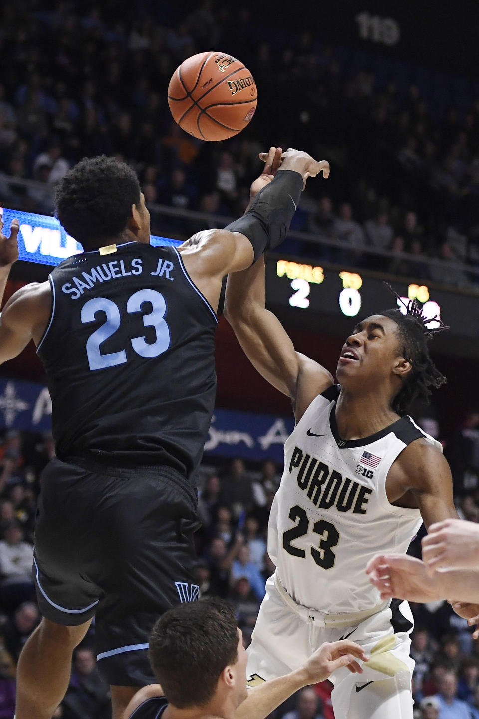 Villanova's Jermaine Samuels, top left, blocks a shot-attempt by Purdue's Jaden Ivey, right, in the first half of an NCAA college basketball game, Sunday, Nov. 21, 2021, in Uncasville, Conn. (AP Photo/Jessica Hill)