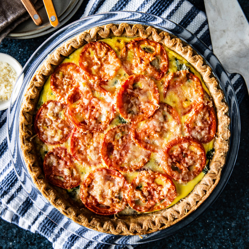 <p>This tender vegetable quiche is packed with produce, including onions, spinach and mushrooms. The Parmesan does double duty, providing cheesiness as well as saltiness. Sliced tomatoes make a lovely topping.</p> <p> <a href="https://www.eatingwell.com/recipe/7914197/loaded-vegetable-quiche/" rel="nofollow noopener" target="_blank" data-ylk="slk:View Recipe;elm:context_link;itc:0;sec:content-canvas" class="link ">View Recipe</a></p>