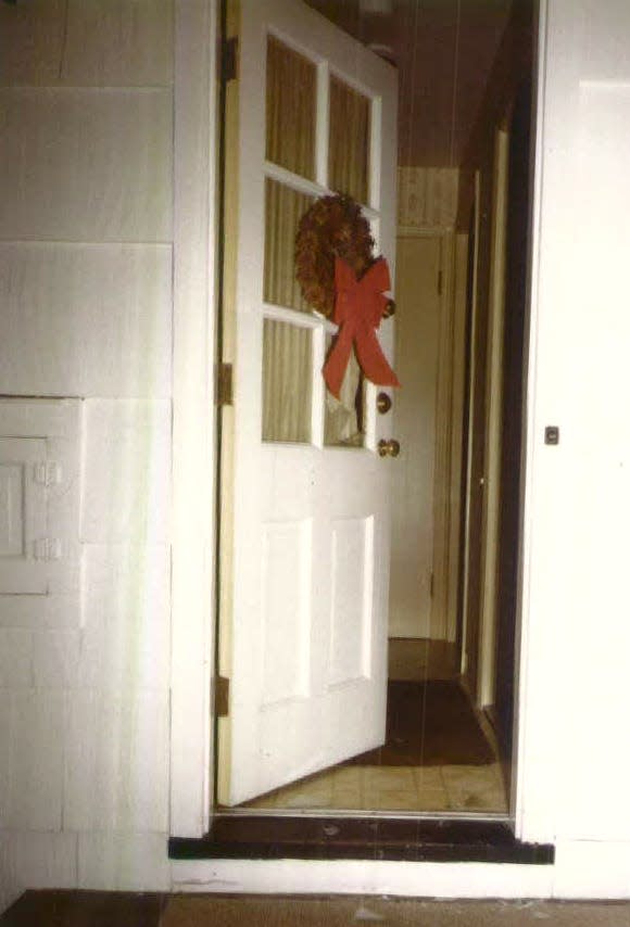 Police photograph of the back door of the Krauseneck's home at 33 Del Rio Drive, Brighton. Glass had been broken by a wood-splitting maul, supposedly so an intruder could get into the house.