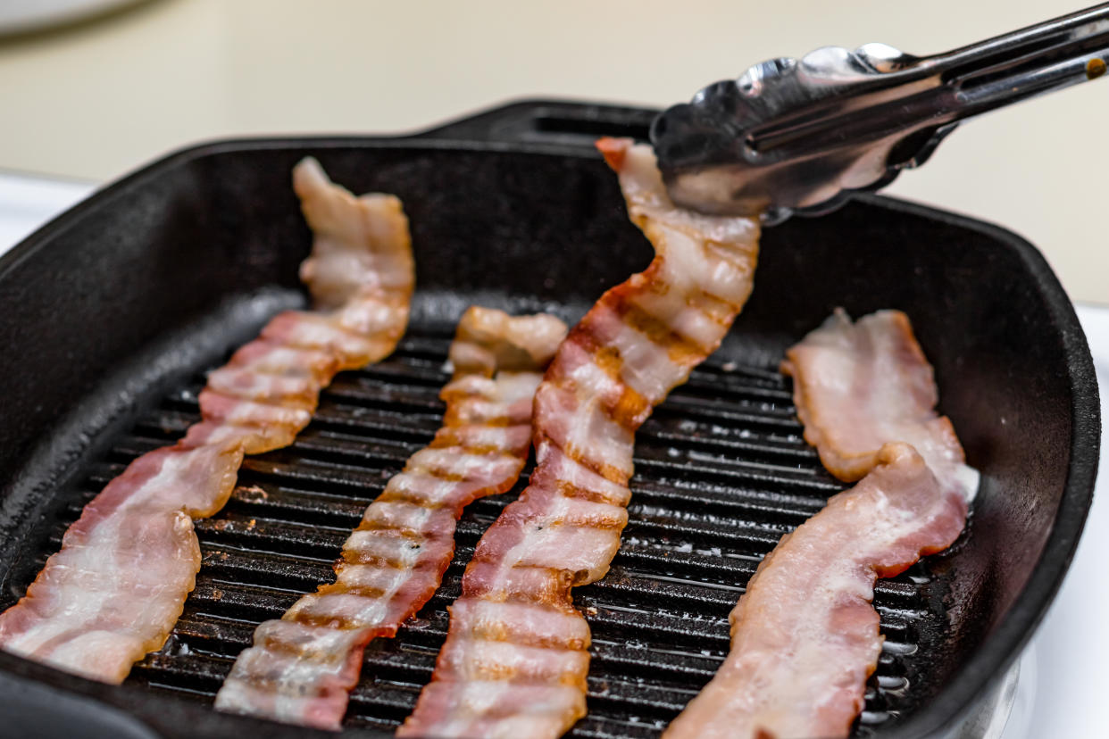 <span class="article-embeddable-caption">Bacon cooked on a griddle</span><cite class="article-embeddable-attribution">Source: Tyler Stuard/Shutterstock</cite>