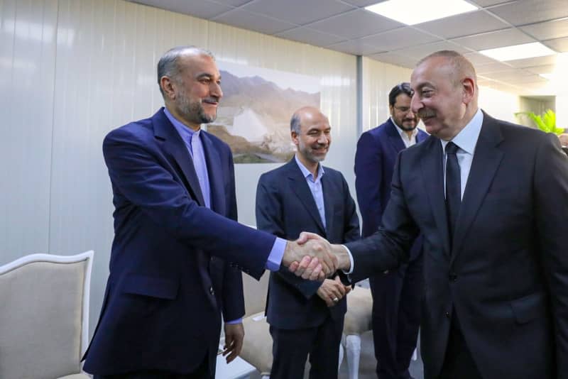 President of Azerbaijan Ilham Aliyev welcomes Iranian Foreign Minister Hossein Amir-Abdollahian during the inauguration ceremony of the Qiz Qalasi Dam, on the Iran-Azerbaijan border.  A helicopter carrying Iranian President Ebrahim Raisi had to make an emergency landing in the west of the country on Sunday, state media reported.  -/dpa