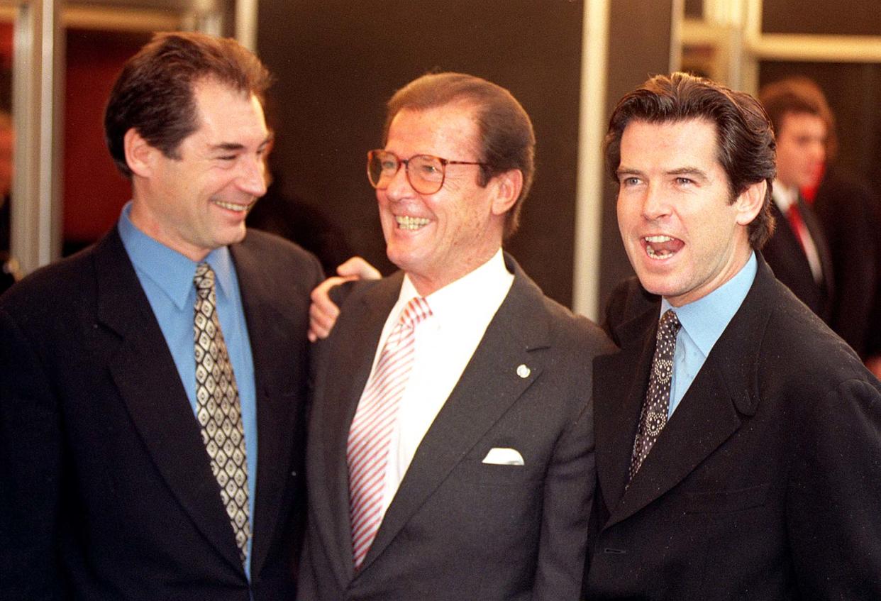 James Bond actors (from left) Timothy Dalton, Roger Moore and Pierce Brosnan arrive for today's (Sunday) memorial service for film producer Albert 'Cubby' Broccoli, at the Odeon, Leicester Square. Photo by Fiona Hanson/PA   (Photo by Fiona Hanson - PA Images/PA Images via Getty Images)