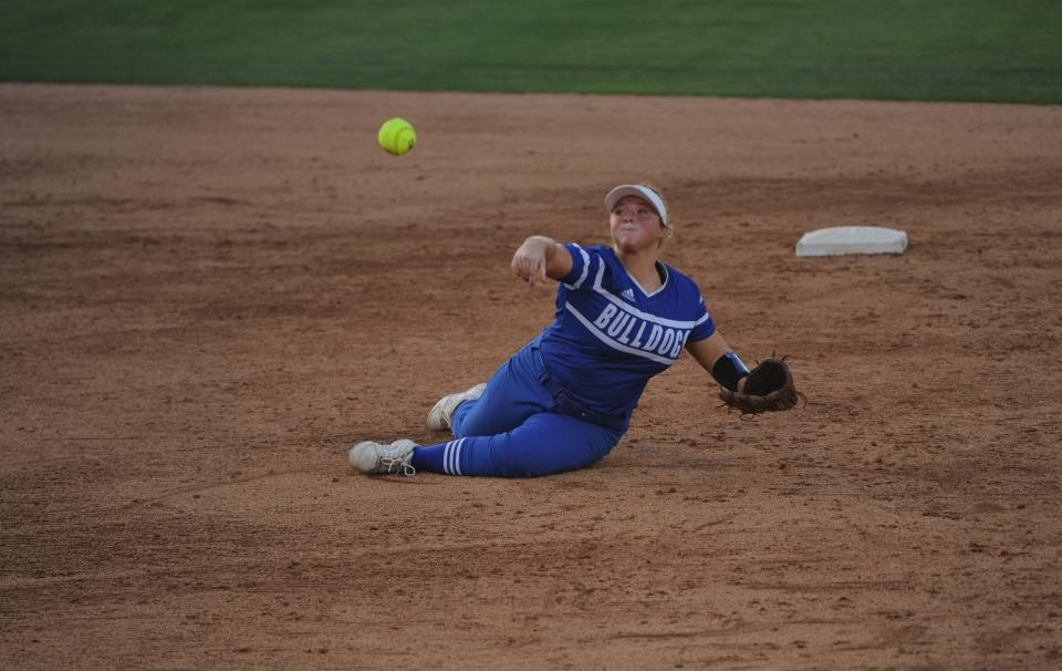 Stamford's Macy Detamore throws to first base after making a diving stop at second against Lovelady in the state semifinals on Tuesday.
