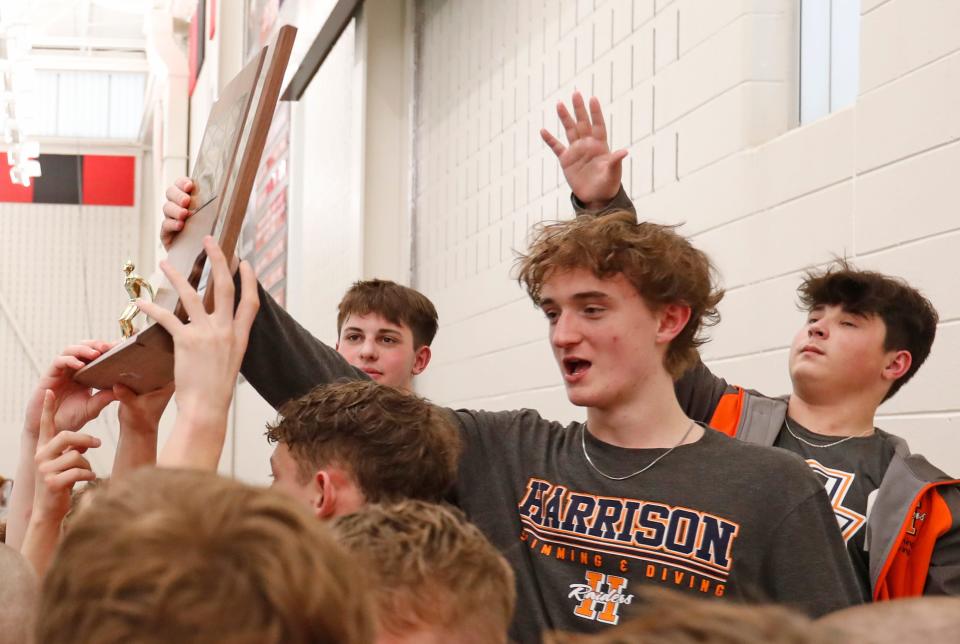 Harrison celebrates after winning the IHSAA swimming and diving sectionals meet, Saturday, Feb. 17, 2024, at Lafayette Jeff High School in Lafayette, Ind.