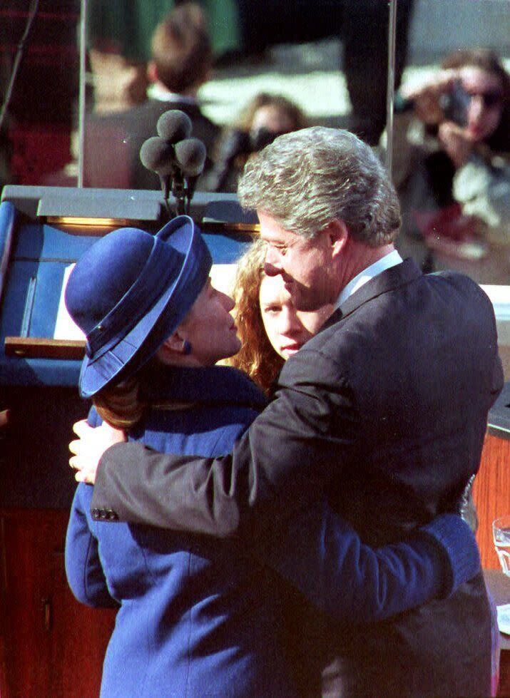 Bill Clinton hugs wife Hillary Clinton and their daughter Chelsea Clinton after he took the oath of office in 1993.