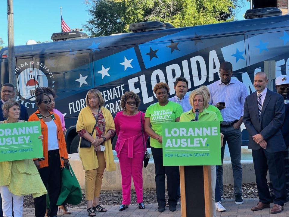 Community leaders and volunteers join Sen. Loranne Ausley for the kickoff of a 35-stop bus tour of Senate District 3.