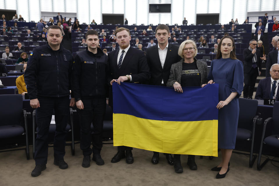 From left to right, Director of the Department for emergency prevention, State Emergency Services of Ukraine Oleksandr Chekryhin, State Emergency Services of Ukraine Stanislav Kulykivskyi, Spokesperson of the Yellow Ribbon Civil Resistance Movement Yaroslav Bozhko, Mayor of Ukrainian city of Melitopol Ivan Fedorov, Founder of the medical evacuation unit Angels of Taira Yulia Paevska and Nobel Peace Prize winner and head of Center for Civil Liberties Oleksandra Matviichuk, pose after receiving the Sakharov Prize for Freedom of Thought Award, the European Union top human rights prize, Wednesday, Dec. 14, 2022 in Strasbourg, eastern France. (AP Photo/Jean-Francois Badias)