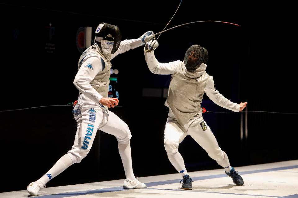 Alessio Foconi (R) of Italy and Andrea Cassara of Italy compete during their men's individual foil fencing final at the FIE World Cup tournament 