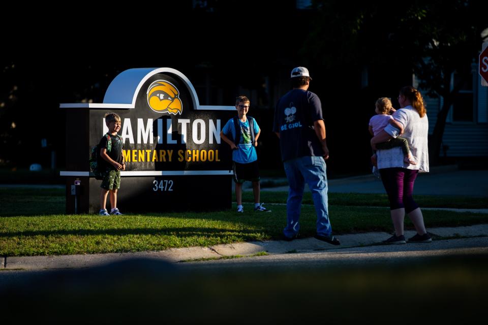 Photos are taken as students arrive for the first day of school Wednesday, Aug. 24, 2022, at Hamilton Elementary.