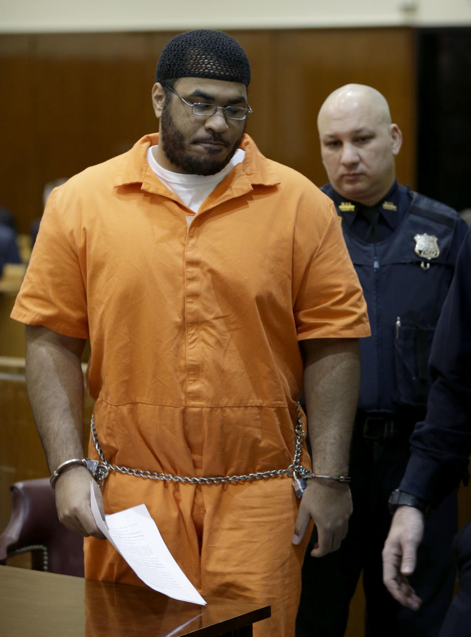 Jose Pimentel stands to leave a courtroom in New York, Wednesday, Feb. 19, 2014. Pimentel, accused of building homemade bombs to wage holy war in New York City, pleaded guilty Wednesday to a terrorism charge less than a week before his scheduled trial in a rare state-level terrorism case. With the plea, Pimentel, 29, was promised a sentence of 16 years in prison. He would have faced a minimum of 15 years to life if convicted of the top charge, a high-level weapons possession offense as a terrorism crime. (AP Photo/Seth Wenig, Pool)