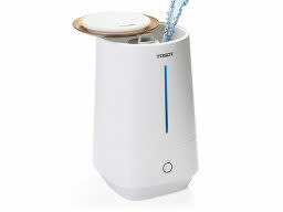 White humidifier with stream of water pouring in