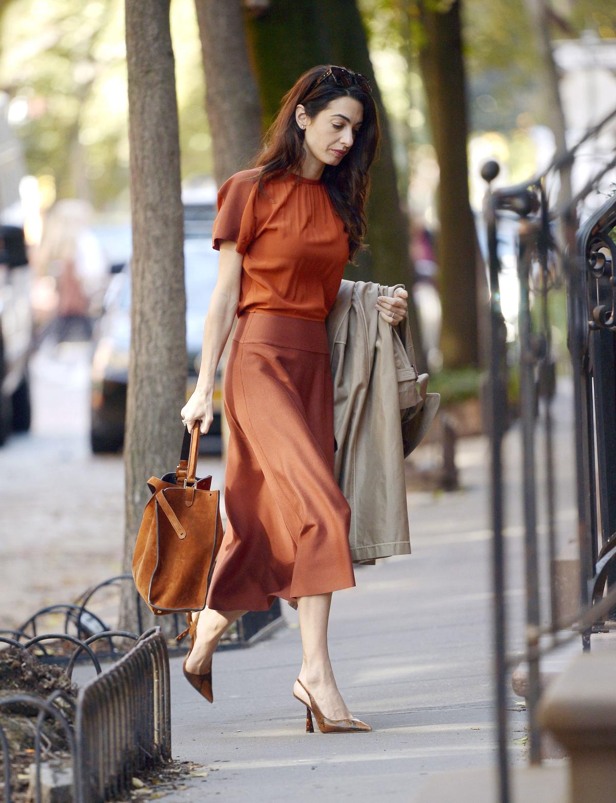 Amal Clooney Wears Fall-Color Top and Midi Skirt in New York City